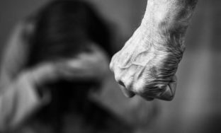 Domestic violence man against woman clenched fist black and white image