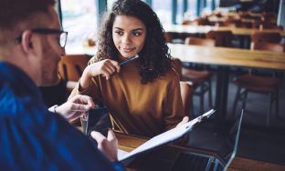 Positive male and female discussing content text for publication during cooperation on publicity area, successful man and woman analyzing information from paper in folder, concept of communication; Shutterstock ID 1362172763; purchase_order: Psychologies; job: Digital