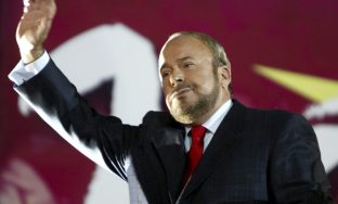 FILE - Then Albanian prime minister and leader Socialist party, Fatos Nano, waves to supporters during the closing rally of the Socialist Party in Albania's capital Tirana on Friday, July 1, 2005. The Albanian government says the country's first post-communist prime minister is in hospital fighting for his life. Fatos Nano founded Albania's Socialist Party in 1991 and served three terms as prime minister. Nano, who's 70 years old, is in intensive care in a hospital in the capital, Tirana, where he's being treated for problems with his lungs. (AP Photo/Visar Kryeziu, File)