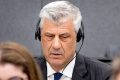 Former Kosovo president Hashim Thaci, left, appears before the Kosovo Tribunal as he defends himself against charges including murder, torture and persecution allegedly committed during his country's war for independence from Serbia in the Hague, Monday, April 3, 2023. The trial of Kosovo's ex-president and three other former high-ranking members of the Kosovo Liberation Army charged with war crimes and crimes against humanity opens Monday. (Koen van Weel/Pool via AP)  LGK101