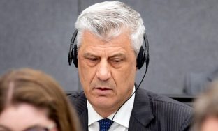 Former Kosovo president Hashim Thaci, left, appears before the Kosovo Tribunal as he defends himself against charges including murder, torture and persecution allegedly committed during his country's war for independence from Serbia in the Hague, Monday, April 3, 2023. The trial of Kosovo's ex-president and three other former high-ranking members of the Kosovo Liberation Army charged with war crimes and crimes against humanity opens Monday. (Koen van Weel/Pool via AP)  LGK101